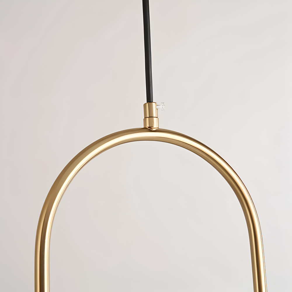 Moderne guld pendel lampe med glaskugle og ellipse design