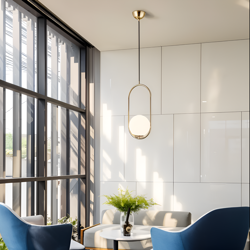 Moderne guld pendel lampe med glaskugle og ellipse design
