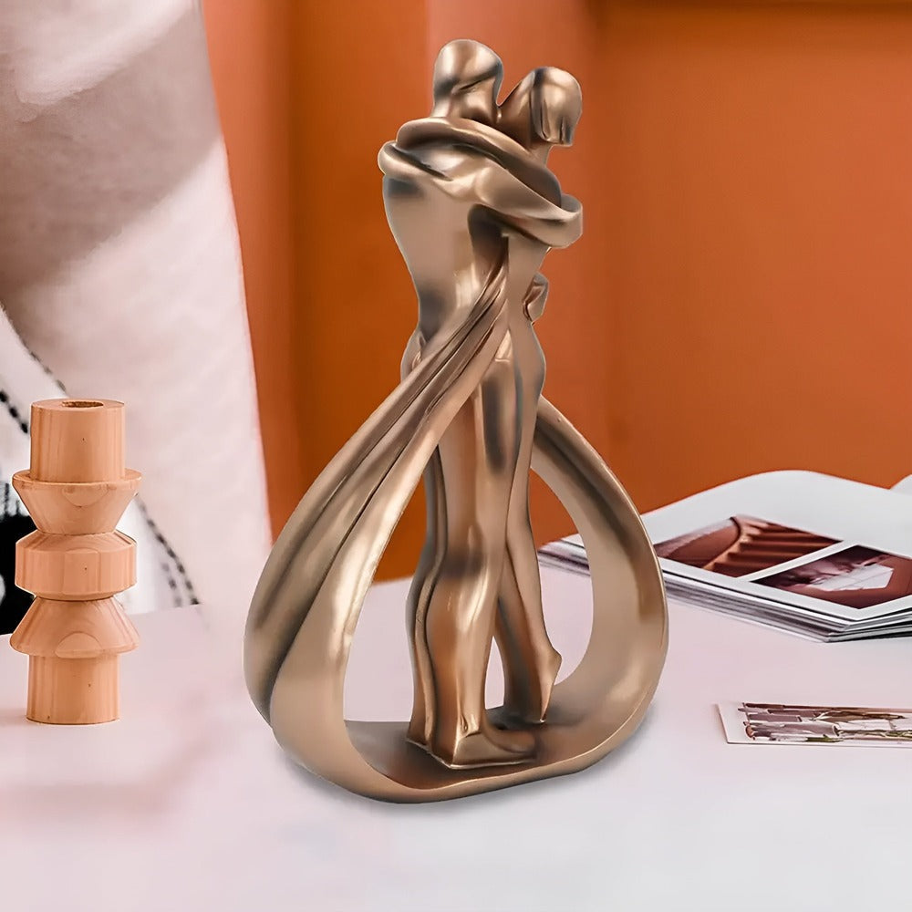 Kyssende par skulptur i abstrakt design – romantisk dekoration