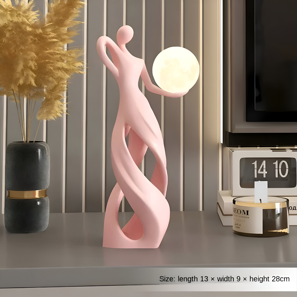 Dekorativ figur lampe i abstrakt design – moderne skulptur med varm belysning