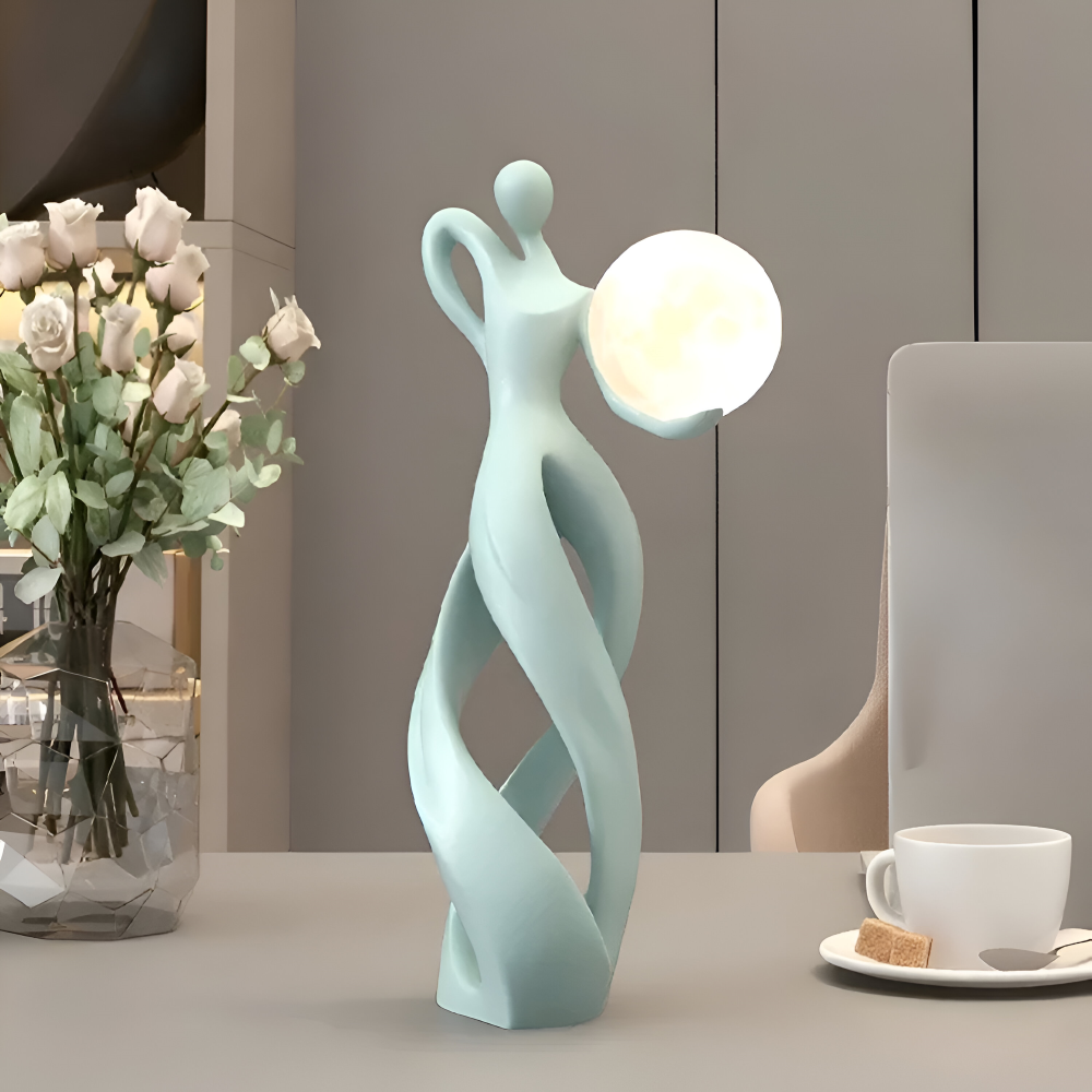 Dekorativ figur lampe i abstrakt design – moderne skulptur med varm belysning