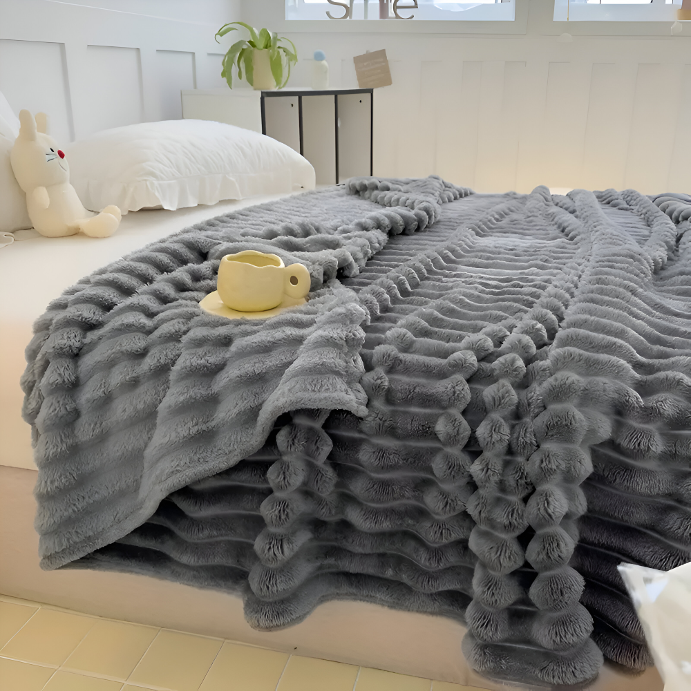 Tyk ribbet fleeceplaid til sofa og seng