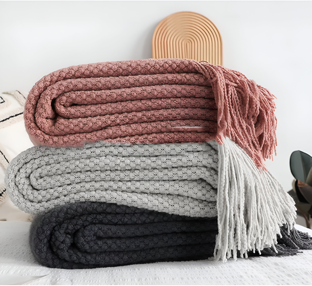 Grovstrikket plaid med kvaster