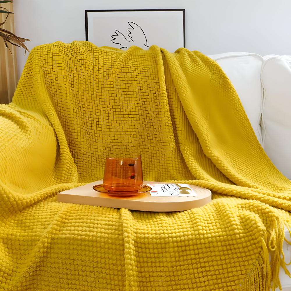 Grovstrikket plaid med kvaster