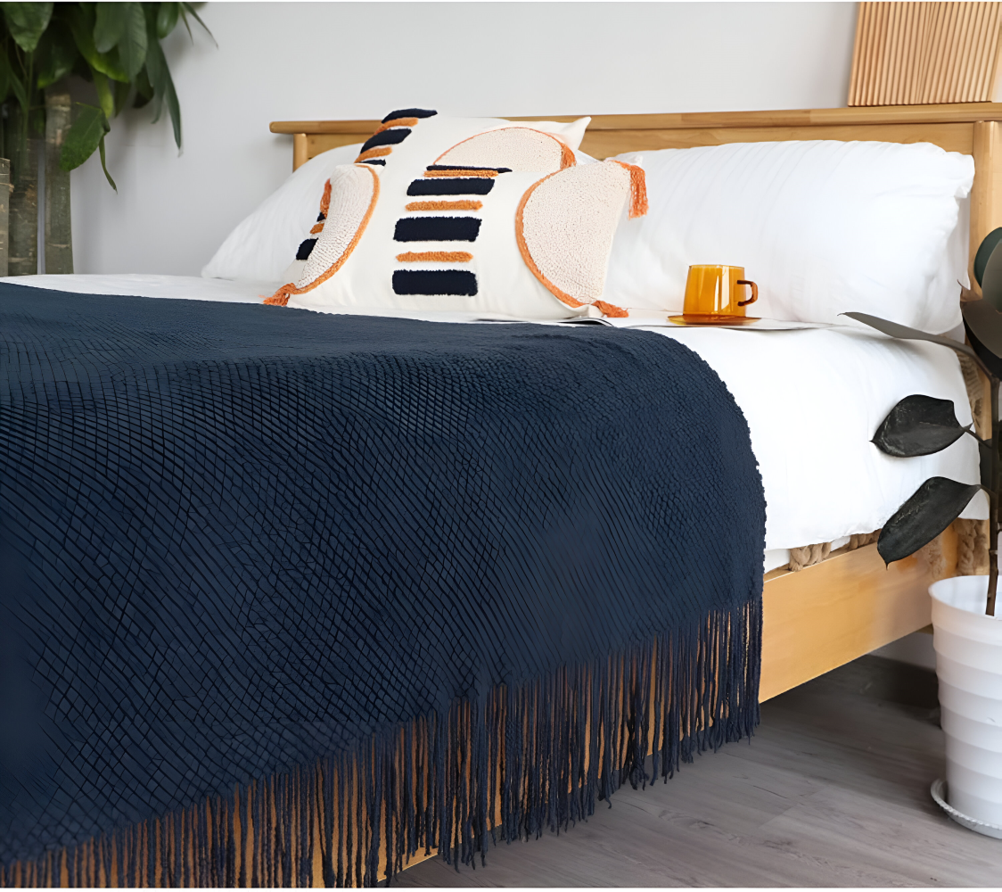 Grovstrikket plaid med kvaster