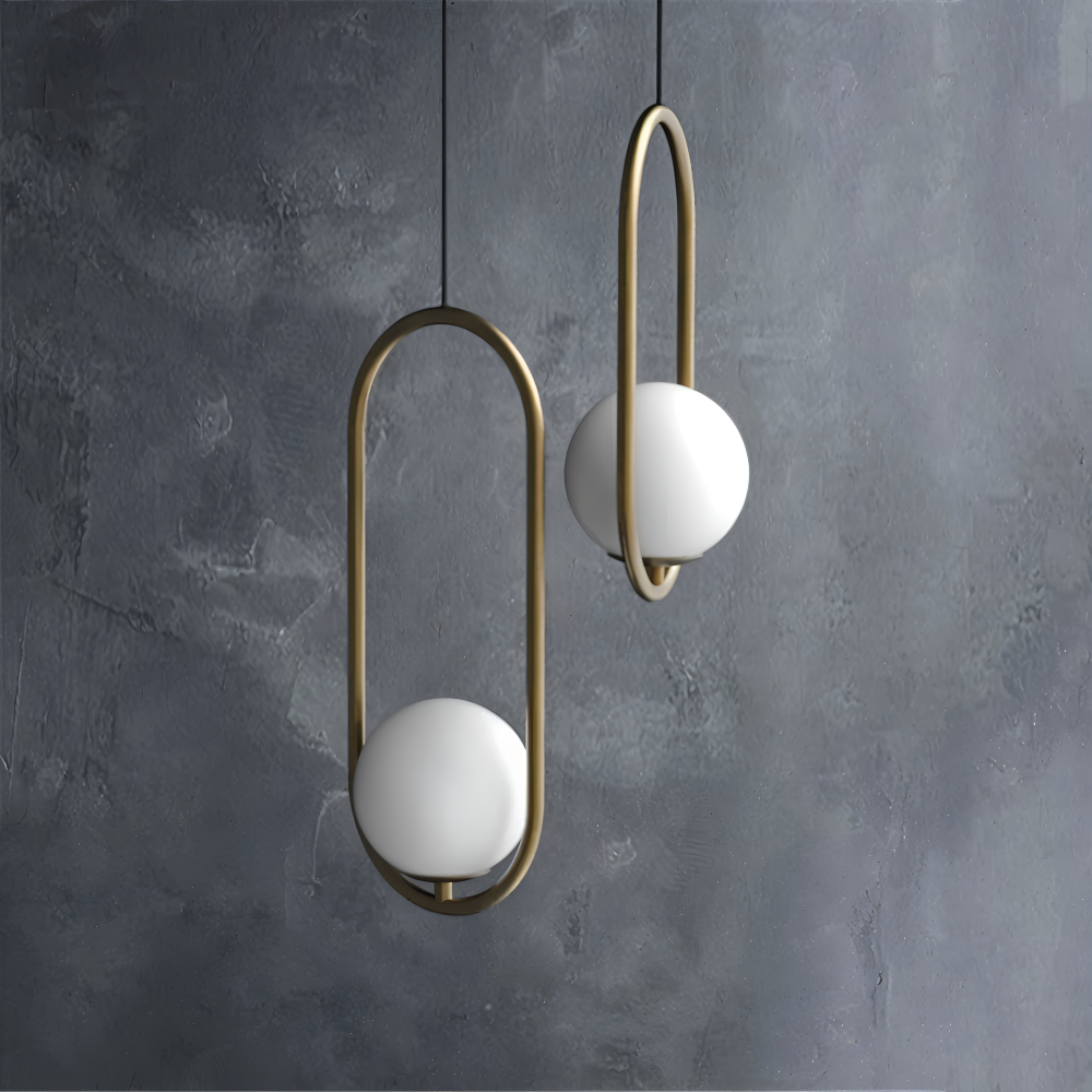 Moderne guld pendel lampe med glaskugle og ellipse design