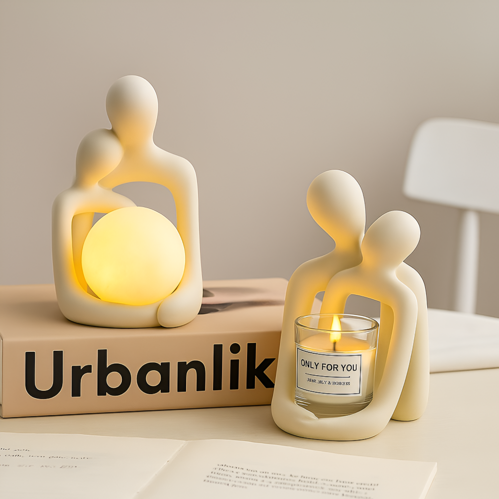 Omfavnende par skulptur med lys – moderne romantisk dekoration