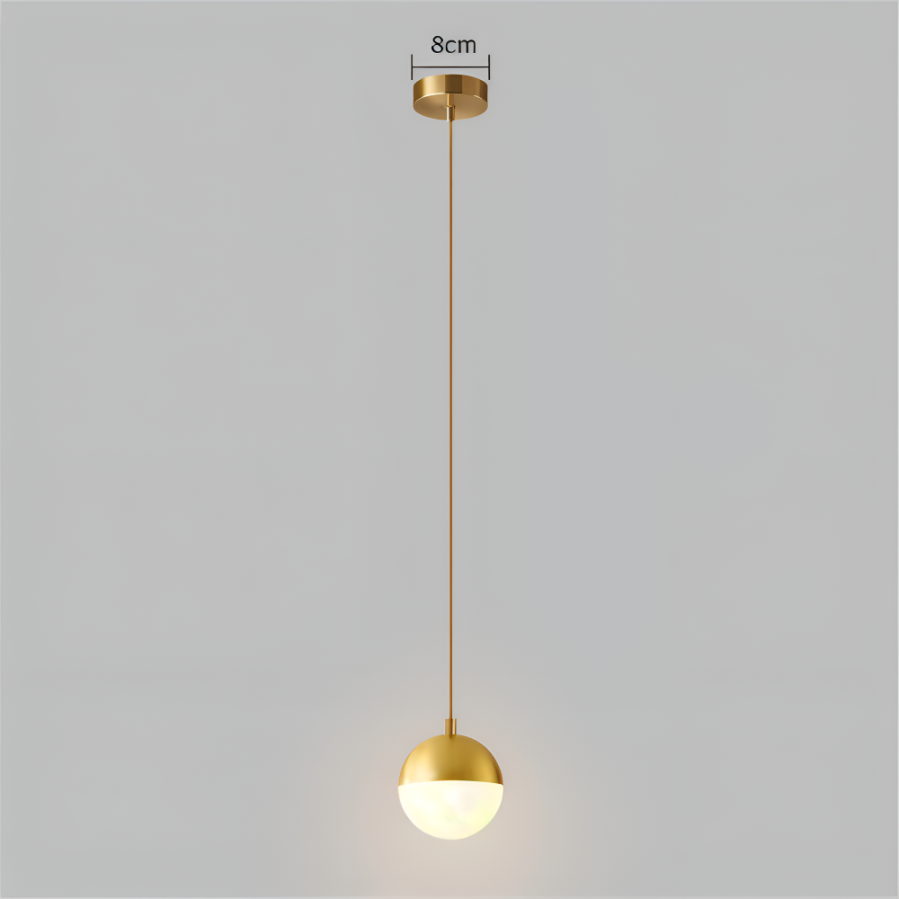 Pendellampe i guld og sort – elegant design med krystalkugle