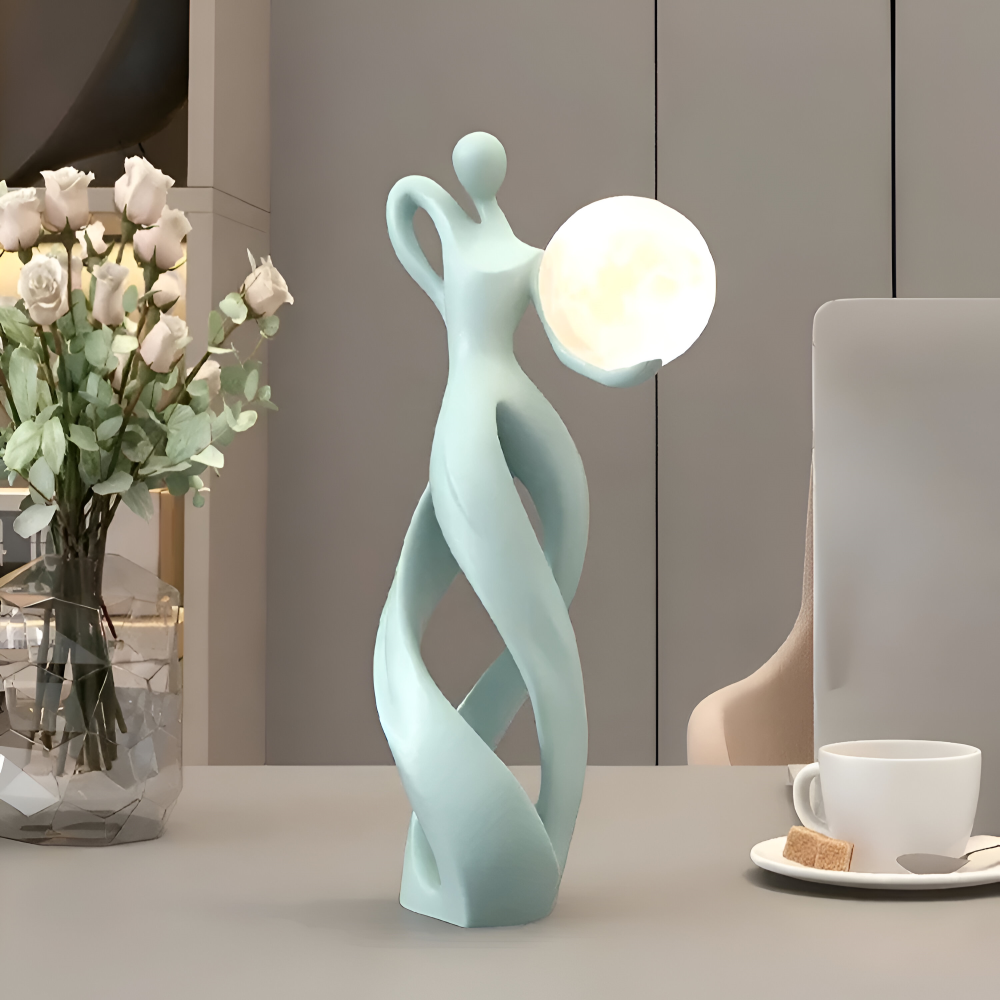 Dekorativ figur lampe i abstrakt design – moderne skulptur med varm belysning