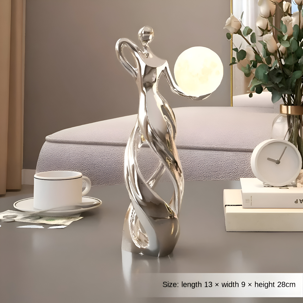 Dekorativ figur lampe i abstrakt design – moderne skulptur med varm belysning