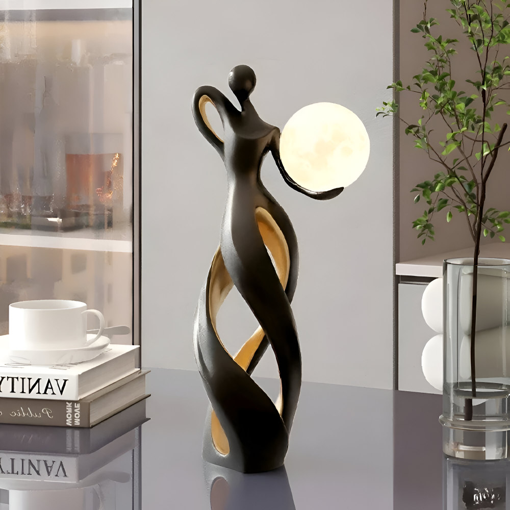 Dekorativ figur lampe i abstrakt design – moderne skulptur med varm belysning