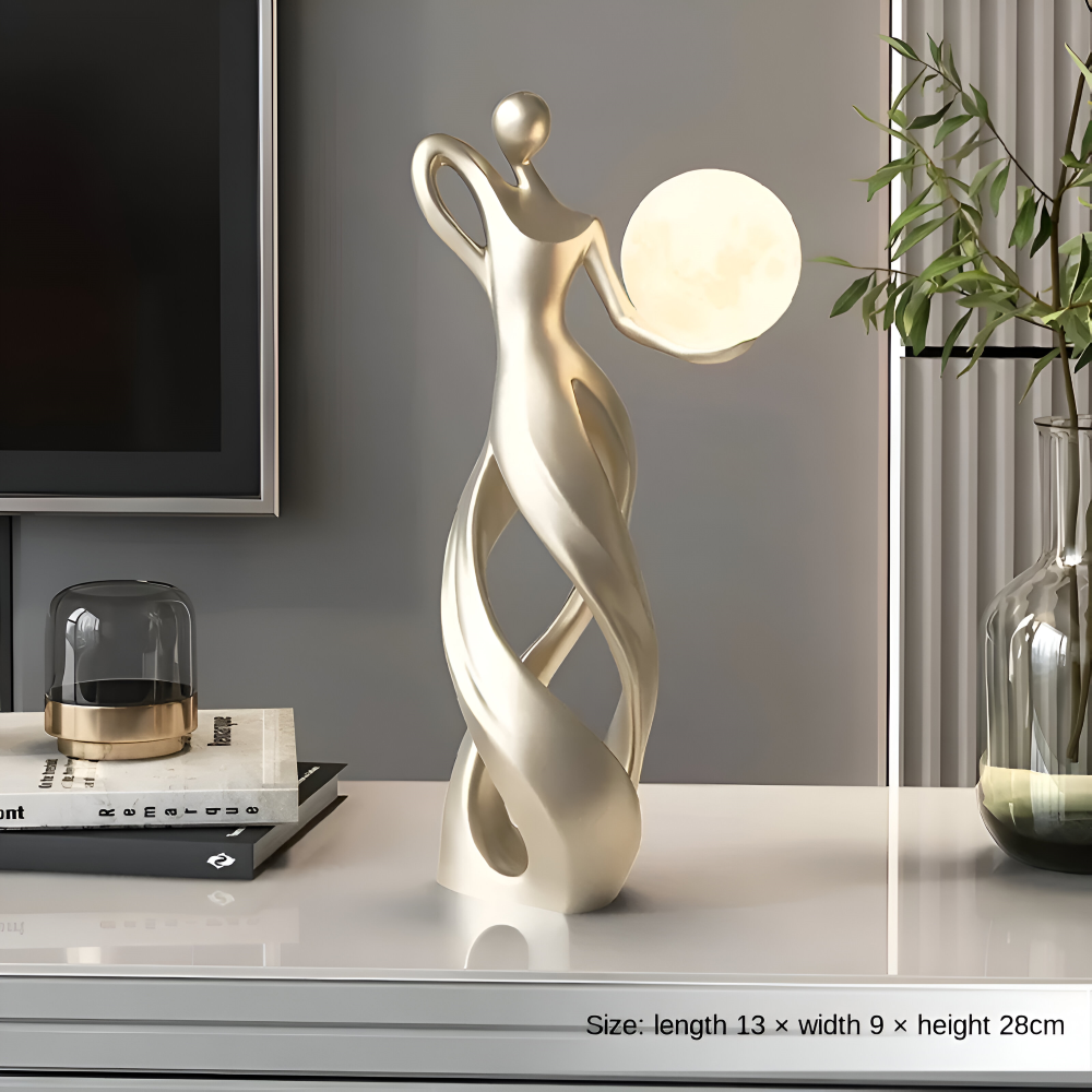 Dekorativ figur lampe i abstrakt design – moderne skulptur med varm belysning