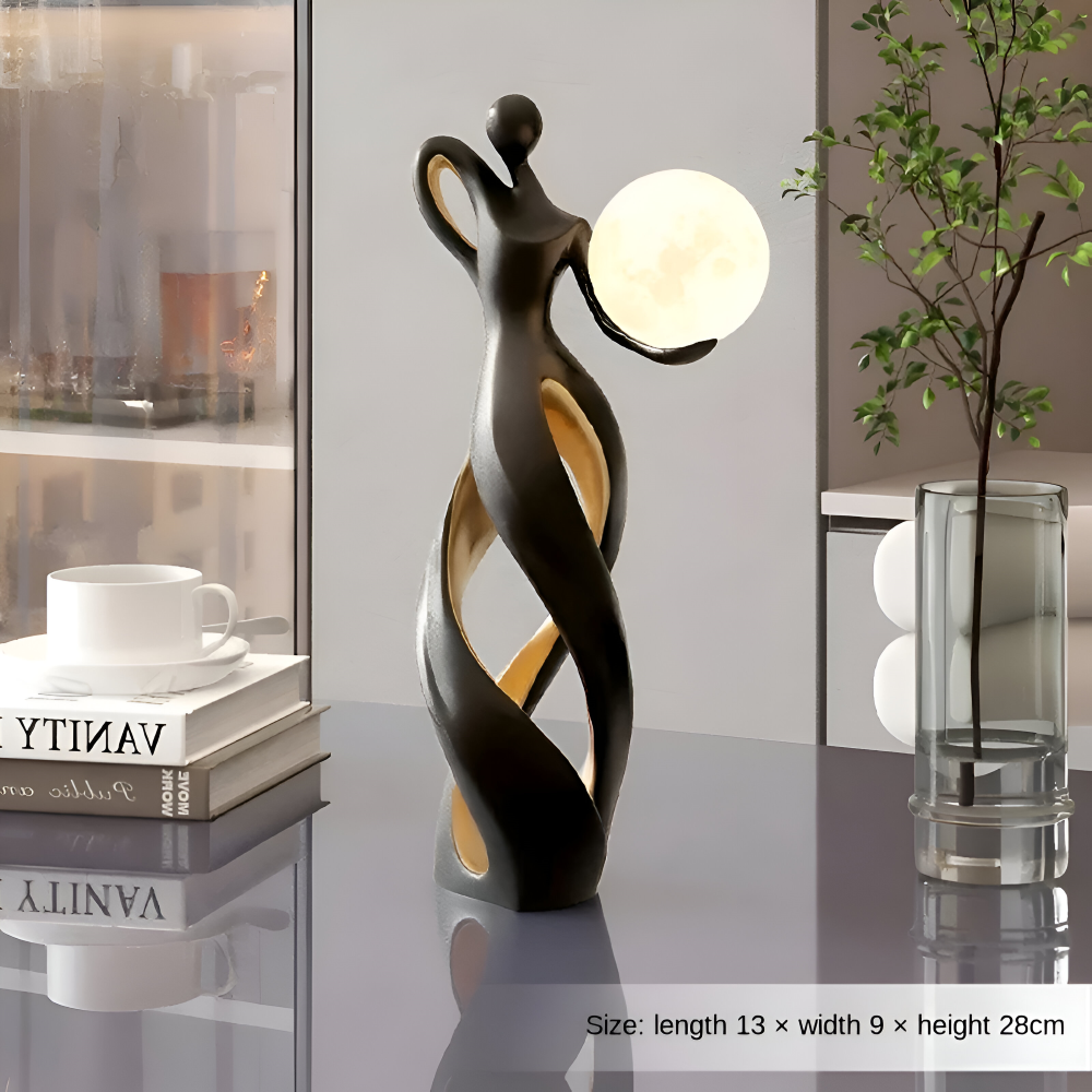 Dekorativ figur lampe i abstrakt design – moderne skulptur med varm belysning