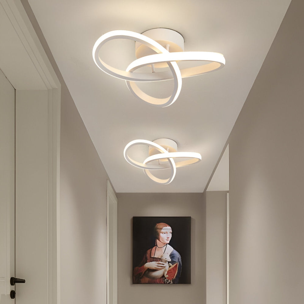 Skulpturel LED-loftlampe med hvirvlende ringe