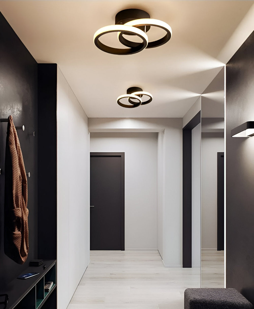 Skulpturel LED-loftlampe med hvirvlende ringe